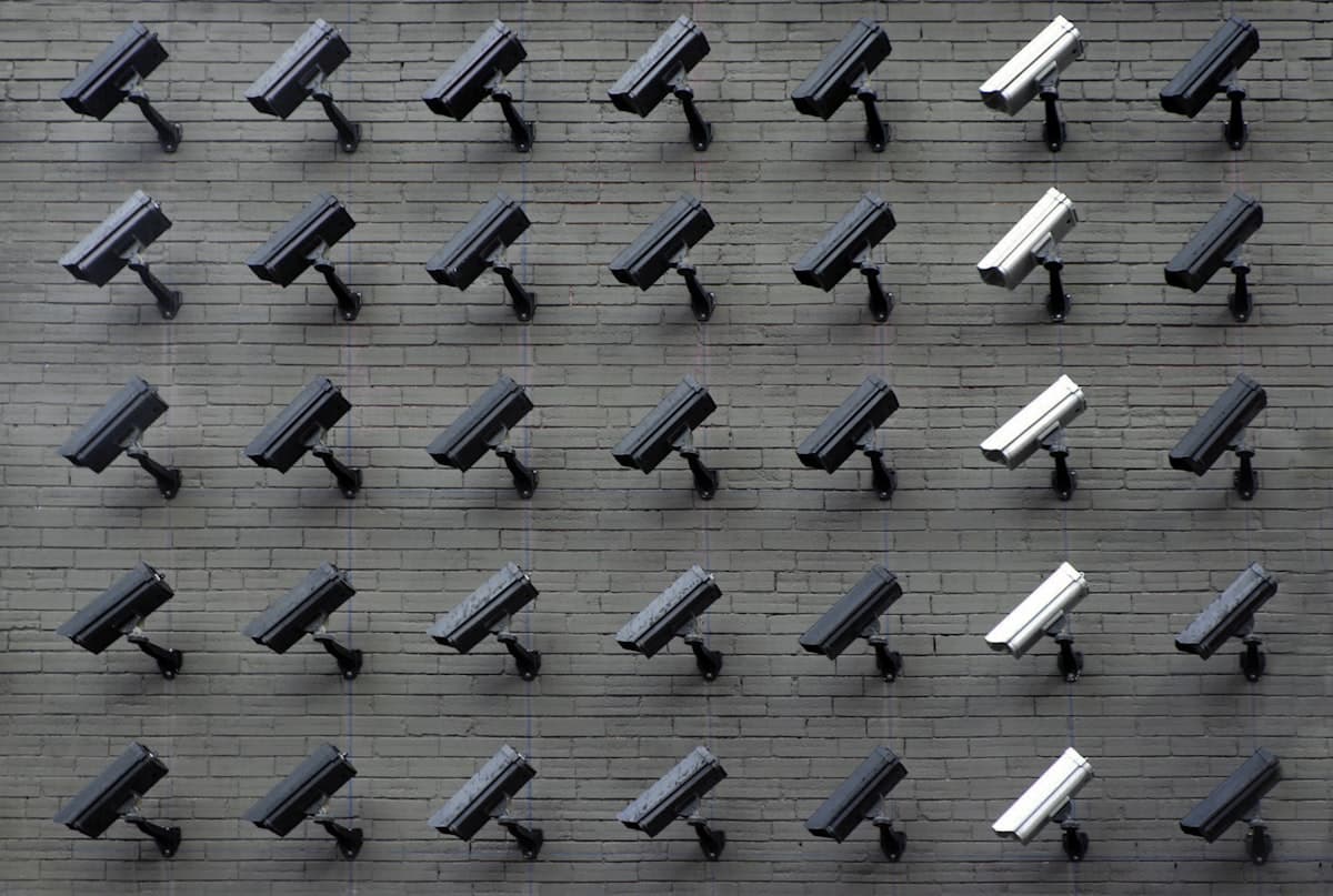 Surveillance cameras mounted on a brick wall