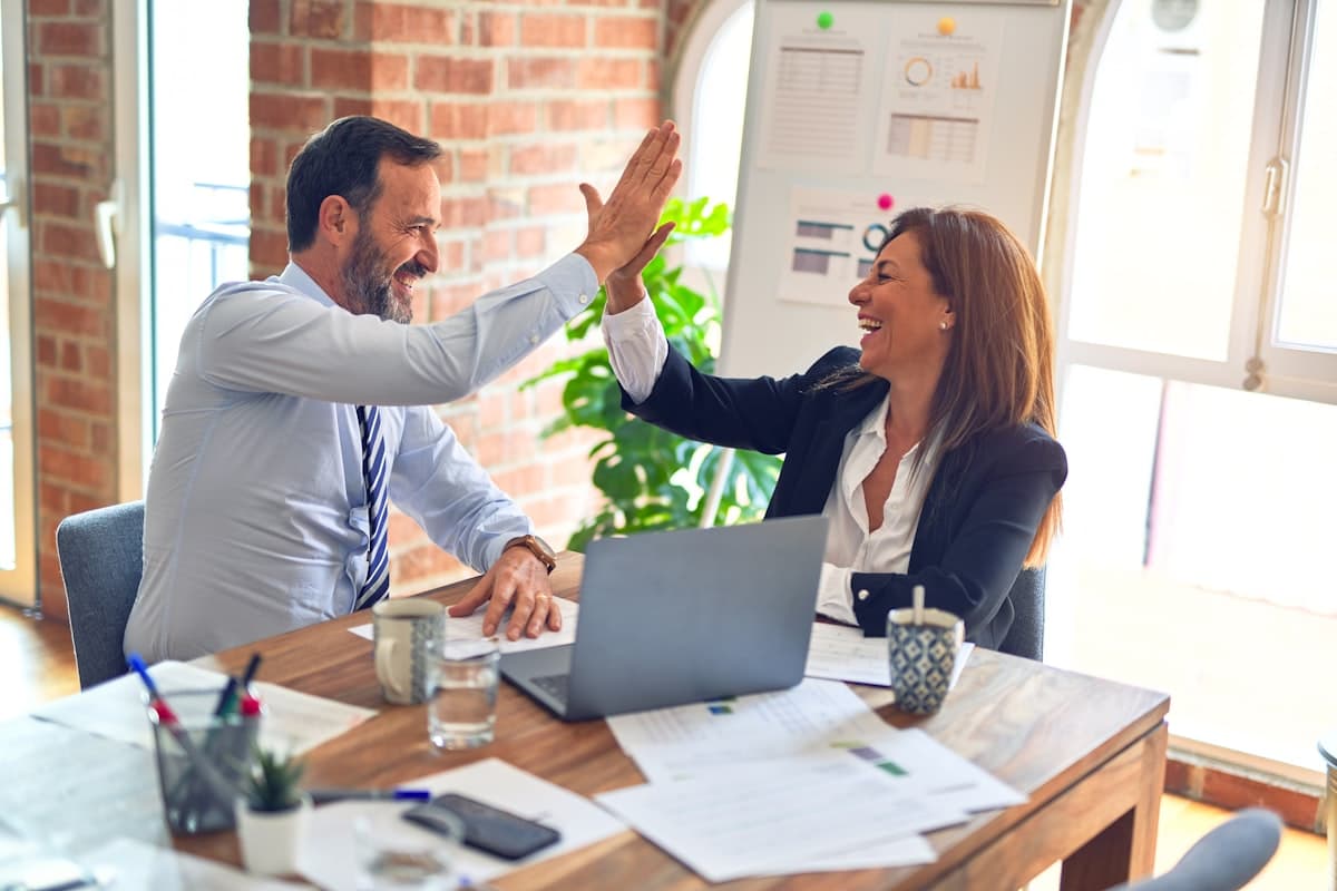 Group of business professionals collaborating around a table in a modern office
